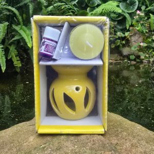 Burner with candle and essential oil